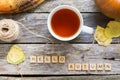Autumn fall flat lay, top view. Fall leaves, mug of tea. pumpkin with inscription hello autumn on rustic wooden