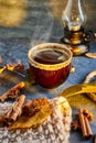 Autumn, fall leaves, a hot steaming cup of coffee and a warm scarf against the background of a blue table. Seasonal, morning Royalty Free Stock Photo