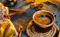 Autumn, fall leaves, a hot steaming cup of coffee and a warm scarf against the background of a blue table. Seasonal, morning Royalty Free Stock Photo