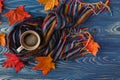 Autumn, fall leaves, hot steaming cup of coffee and a warm scarf Royalty Free Stock Photo