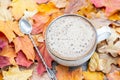 Autumn, fall leaves, hot steaming cup of coffee on wooden table background. Seasonal, morning coffee, Sunday relaxing Royalty Free Stock Photo