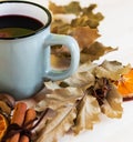 Autumn, fall leaves, hot steaming cup of glint wine