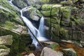 Autumn fall mountain waterfall stream in the rocks with colorful fallen dry leaves, landscape, natural seasonal background Royalty Free Stock Photo