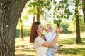 Autumn family walk in forest. Happy mother and baby boy. Family with little son in autumn park. Family and mother`s day. Children Royalty Free Stock Photo