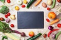 Autumn farm vegetables, root crops and slate cutting board top view with copy space for menu or recipe. Healthy and organic food. Royalty Free Stock Photo