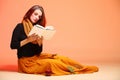 Autumn fashion girl with book orange eye-lashes Royalty Free Stock Photo