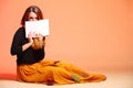 Autumn fashion girl with book orange eye-lashes Royalty Free Stock Photo