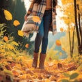 Autumn fashion woman in jeans and boots walking in park Royalty Free Stock Photo