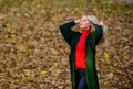 Autumn fashionable cardigan. Woman wear long wool cardigan while walk in park. Fall fashion warm cardigan. Girl stylish