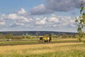 Sugar beets harvesting,Autumn in the field harvesting machine collects sugar beet, agriculture harvest season