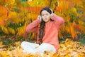 Autumn is finally here. Special instrumental music collection for total relax. Kid girl relaxing near autumn tree with