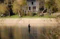 Autumn fisherman in the Semois, Belgian river Royalty Free Stock Photo