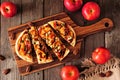 Autumn flat bread with apples, pecans, red onion, and blue cheese, top view table scene on wood Royalty Free Stock Photo