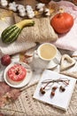 Autumn flat lay with coffee ,donut and pumpkins