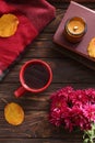 Autumn flat lay composition with beautiful chrysanthemum flowers and cup of tea on wooden table Royalty Free Stock Photo