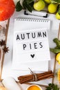 Autumn flat lay with lightbox with the phrase Autumn pies. Top view. Food ingredients for making autumn pumpkin pie on a Royalty Free Stock Photo