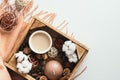 Autumn flatlay composition. Brown plaid and wooden box with coffee cup, candle, cotton, decorations