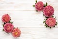 Autumn floral background - pink asters on white wooden table.