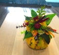 Autumn floral bouquet in a pumpkin vase. Bright autumn composition for Halloween