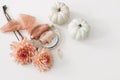 Autumn floral wedding composition, feminine still life. Pink dahlia flowers, silk ribbons and white pumpkins isolated on Royalty Free Stock Photo