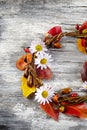 Autumn floral wreath on rustic wooden background Royalty Free Stock Photo