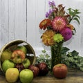 Autumn Flower Bouquet and Basket of Apples Royalty Free Stock Photo