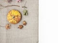 Autumn flowers, plants and fruits on jute background