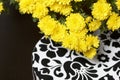 Autumn flowers in a pot. Yellow Chrysanthemum. Next gift in a cardboard box with an ornament. On a gray background. Royalty Free Stock Photo