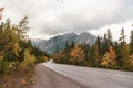 Autumn foliage at mountain avenue road to Baff gondola and sulphur mountain with Mount Norquay background Royalty Free Stock Photo