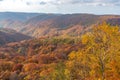 Autumn foliage scenery. Aerial view of valley and stream in fall season. Royalty Free Stock Photo