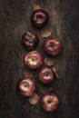 Autumn food background. Ripe apples with fallen leaves on rustic wooden table. Top view. Copy space