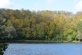 autumn forest at a blue caldera lake, Holzmaar Royalty Free Stock Photo