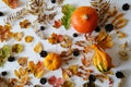 Autumn forest elements on a white background top view: pumpkins, leaves and cones. Layout, flatlay