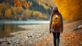 Autumn forest hike woman walking on trail in vibrant fall nature, active hiking lifestyle Royalty Free Stock Photo