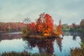 Autumn forest on an island in the middle of a pond in the morning fog. Mystical morning autumn landscape with fog over the lake Royalty Free Stock Photo