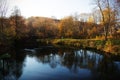 Autumn forest landscape with clear river water Royalty Free Stock Photo