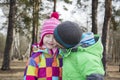 In autumn forest little boy kissing his girlfriend girl. Royalty Free Stock Photo