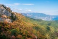 Autumn forest, mountains and sea. Golden autumn landscape. Bright Sunny water. Natural background with rocks. A wonderful Royalty Free Stock Photo