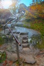 Autumn forest in the mountains and stairs in rock Royalty Free Stock Photo