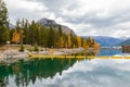 Autumn forest reflected in water. Colorful autumn morning in the mountains. Colourful autumn morning in mountain lake