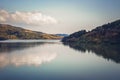 Autumn forest reflected in the water. Colorful autumn morning in the mountains Royalty Free Stock Photo