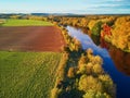 Autumn forest and river Vienne near medieval castle of Les Ormes, France Royalty Free Stock Photo