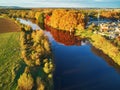 Autumn forest and river Vienne near medieval castle of Les Ormes, France Royalty Free Stock Photo