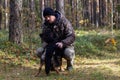 Autumn, forest and sincere friendship between man and dog