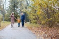 Autumn forest walk with the son family Royalty Free Stock Photo