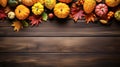 Autumn frame. Colorful maple leaves and pumpkins on wooden background. Flat lay, top view, copy space. Autumn fall, harvest, Royalty Free Stock Photo