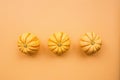 Autumn frame made of pumpkins isolated on pastel orange background. Fall, Halloween and Thanksgiving concept. Styled stock flat Royalty Free Stock Photo