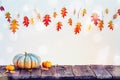 Autumn frame with pumpkins and colorful leaves