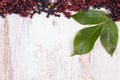 Autumn fresh elderberry with leaf and copy space for text on old wooden background Royalty Free Stock Photo