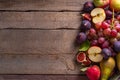 Autumn fruit assortment on wooden background